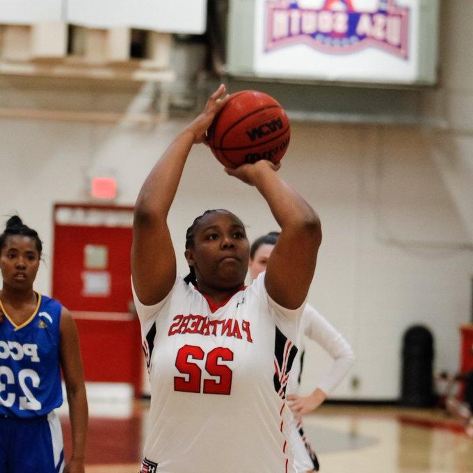 Woman shooting hoops